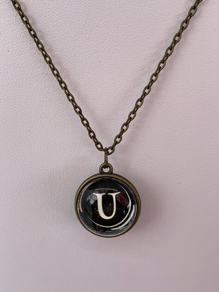 Double Sided Letter Necklace White Text on Black Background