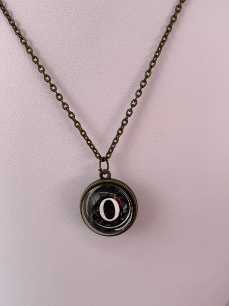 Double Sided Letter Necklace White Text on Black Background