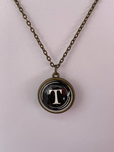 Double Sided Letter Necklace White Text on Black Background