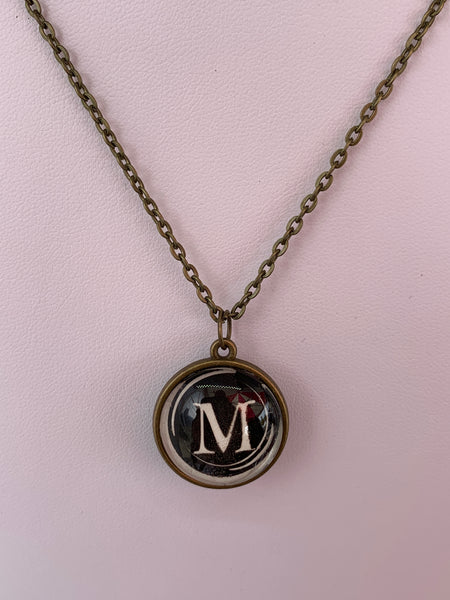 Double Sided Letter Necklace White Text on Black Background