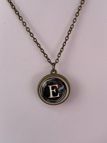 Double Sided Letter Necklace White Text on Black Background