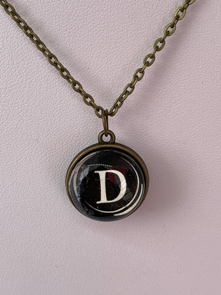 Double Sided Letter Necklace White Text on Black Background