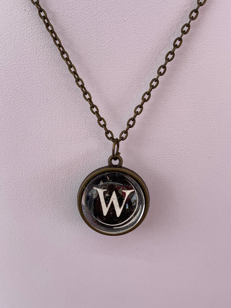 Double Sided Letter Necklace White Text on Black Background