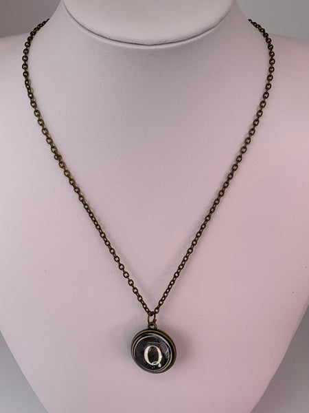 Double Sided Letter Necklace White Text on Black Background