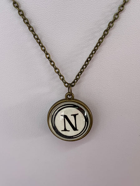 Double Sided Letter Necklace Black Text on White Background